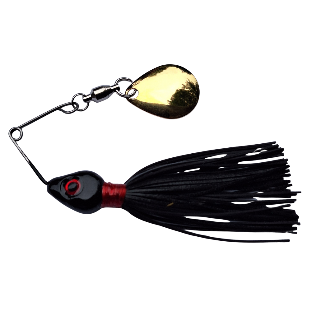 Fishing lure with black skirt and gold blade on a white background